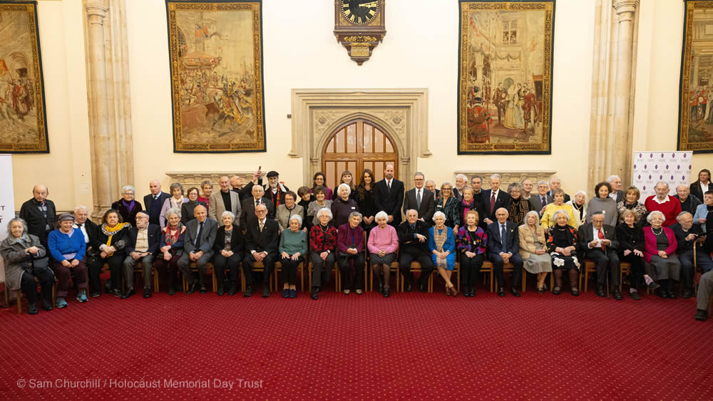 Holocaust survivors alongside Their Royal Highnesses The Prince and Princess of Wales, and the Prime Minister Sir Keir Starmer.